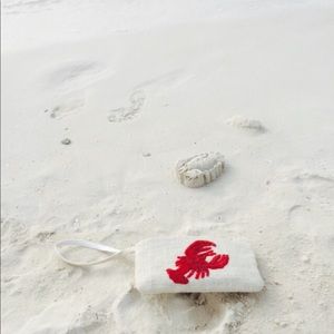 Moyna straw clutch with a lobster embroidered on